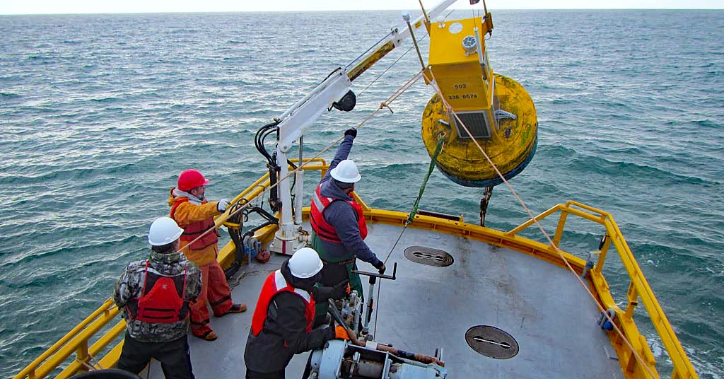 Coastal Margin Observation and Prediction (CMOP) workers drop a load.