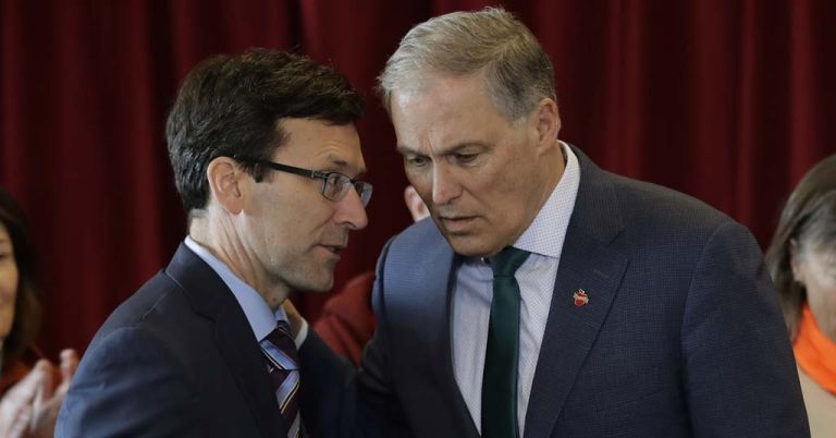 Bob Ferguson and Jay Inslee consult