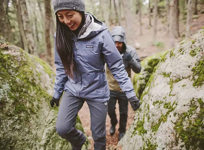 Hikers on a trail in rain gear