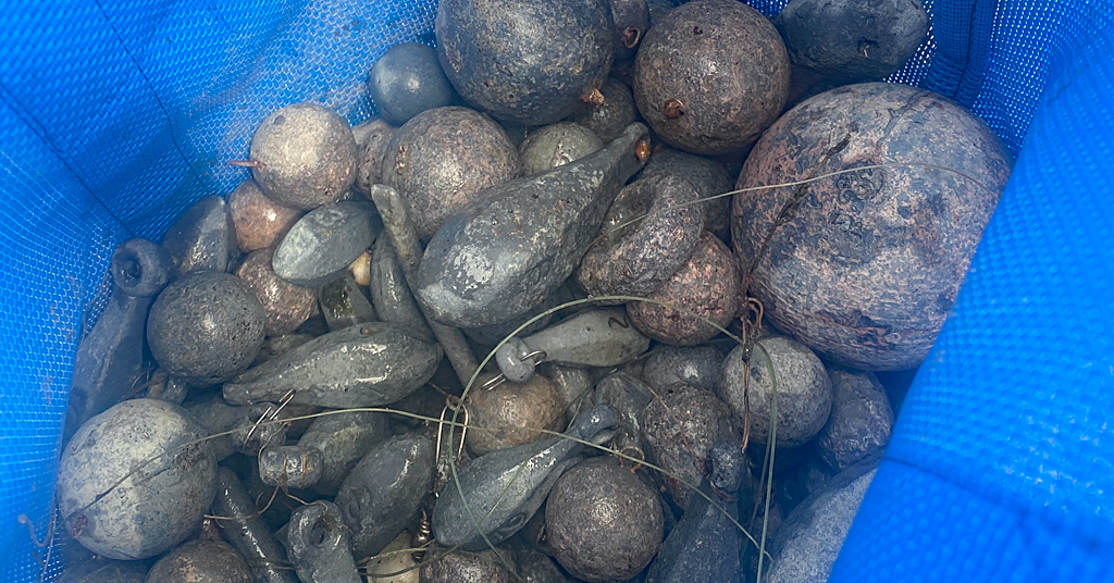 Leads weights removed from Columbia River by diver Mayo Archer.