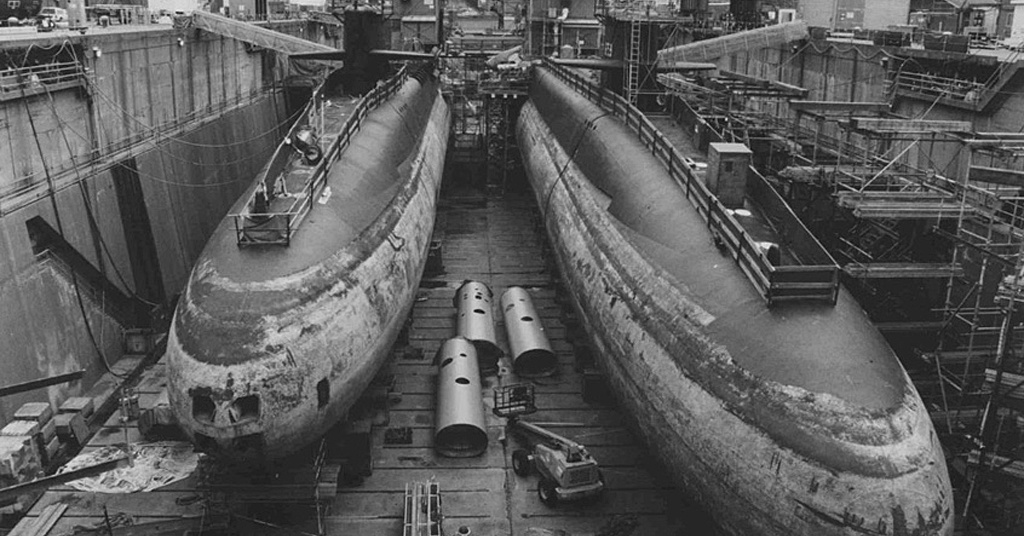 Submarines in drydock for defueling, reactor compartment removal and recycling