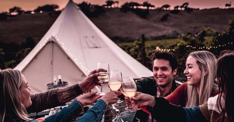 Glampers hoisting wine glasses