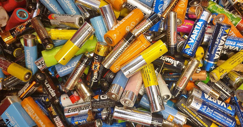 Pile of used AA batteries.
